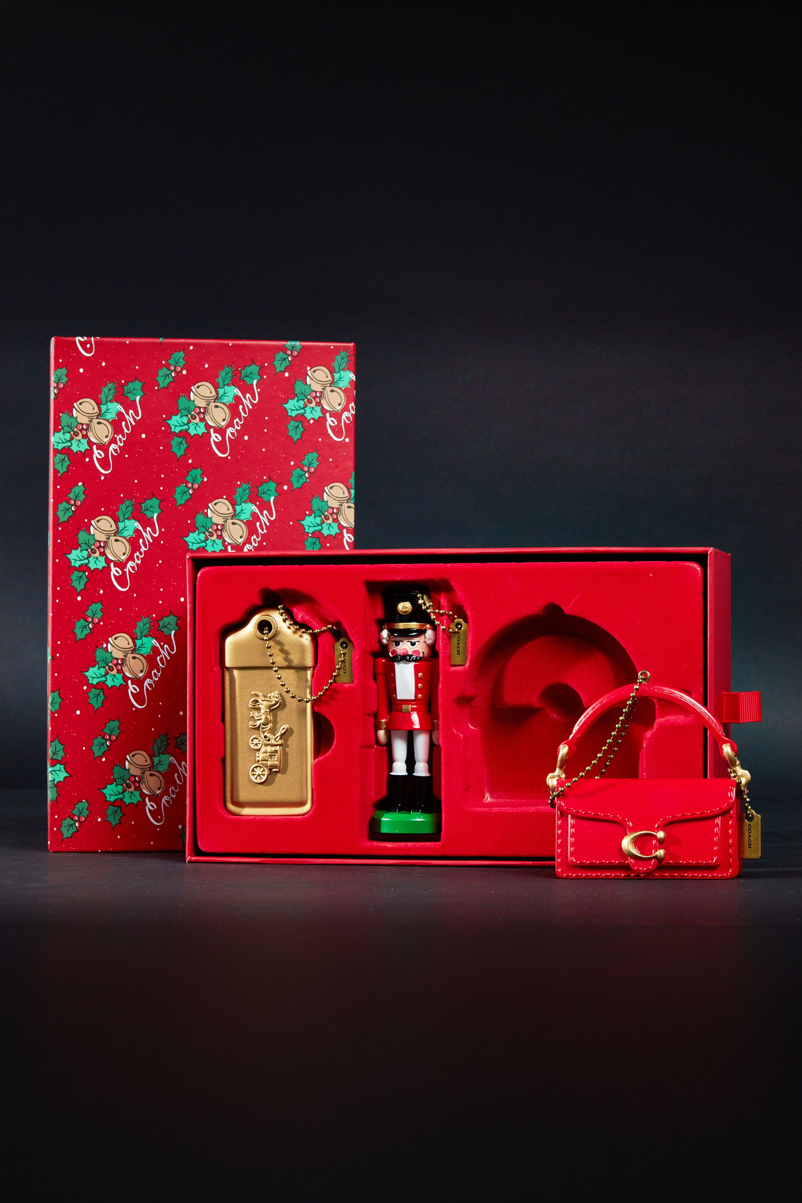 Coach holiday ornament collection with custom packaging and seasonal gifting design